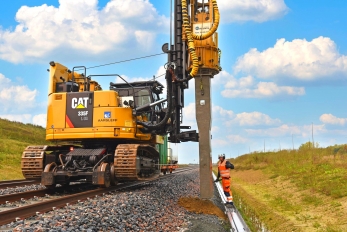 Caterpillar железнодорожный вибропогружатель